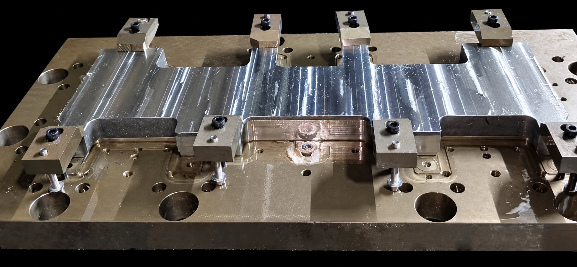 Workholding and machined features on a liquid cooling plate